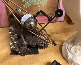 metal sculpture of kayaker