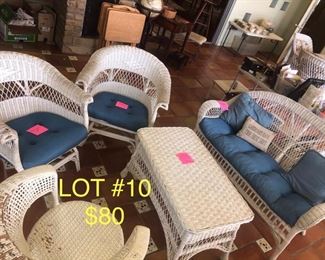 lot No. 10 Includes a wicker sofa and coffee table and three club chairs