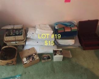 lot No. 19 Includes a vintage sewing kit comforters and hand made blankets and silver holder plus more
