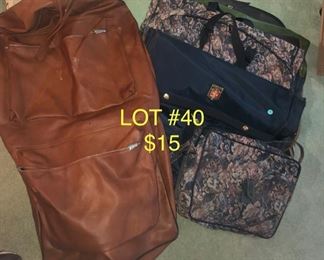 Lot no 40 includes leather garment bag and three other luggage items.