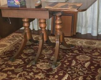 Antique table pulls out with additional leaves to seat 8 to 10