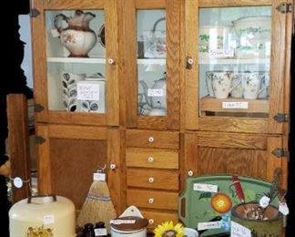 Wooden Hoosier Cabinet-SOLD
Plant-$20
My Heart is Happy Here-$40
3 Vintage Bowls with vines-$25
Bowl with Lid-$15
8 Mugs-$15
Tea Set-40
Large Pitcher-$10
Covered Cake Plate-$20
Broom-$5
Vegas S&P-$3
Antique Master Salt-$70
2 Enamel Pans-$8
Fruit Tray-$12
Asst Red Handled Kitchen Tools $5ea
Mini Pan-$3
