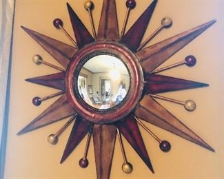 Metal star wall art with convex mirror priced @ $44.00 measuring 33 inches tall and 27 inches wide