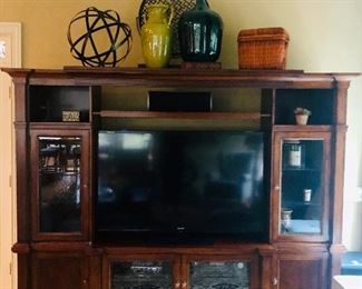 Gorgeous entertainment center priced at $585.00 measuring 102 inches wide x 21 inches deep x 78 inches tall. TV sold separately, 60 inch Sharp Aquos 3D TV priced at $599.00