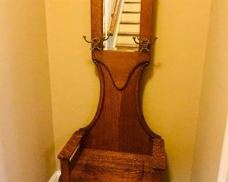 Antique hall tree with mirror and seat storage @ $325.00 measuring 6ft tall x 26 inches wide x 15 inches deep