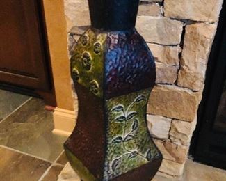Decorative metal vase $24.00 measuring 29 inches tall