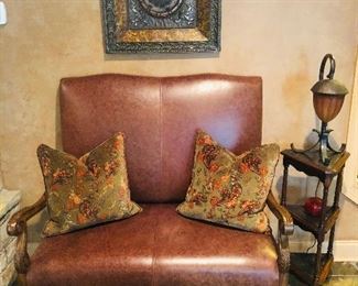 Brown leather settee measures approx. 24 inches wide x 24 inches long x 2 ft. deep