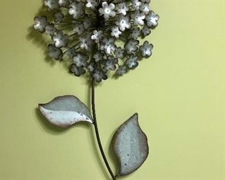Metal flower wall art $24.00 measuring 29 inches long and 1ft wide.