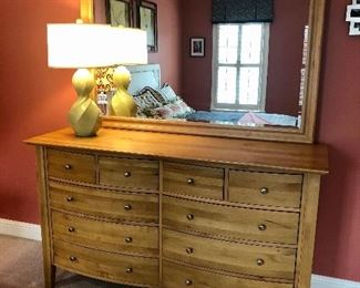 Havertys dresser with mirror in natural wood $425.00 (originally $999) measuring approx. 65 inches wide x 84 inches tall (without mirror ) x 22 inches deep.