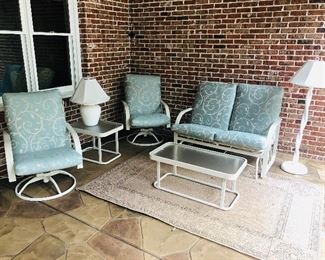 Outdoor 2 seater glider $88.00, 2 swivel rockers $60.00 each, accent table $52.00, coffee table $78.00, white floor lamp $125.00 and white table lamp $58.00, arm chair (not shown) $45.00 , outdoor table (not shown) $95.00