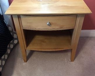 Nightstand in natural wood color measuring 27.5” tall x 27” wide x 19 1/4” deep $110