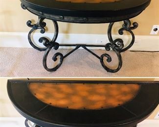 Half moon table with heavy wrought iron base and copper insert on top with nail head trim priced at $340 and measuring ____________________.