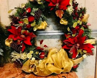 Christmas wreath with red poinsettias and gold accents $74.00