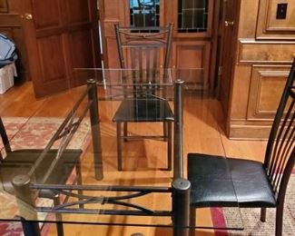 Glass top table and 4 chairs, $95