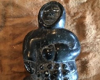 Inuit 1950s soapstone carving from Canada. Signature on bottom in numbers and symbols. $275. 5 1/4” tall.