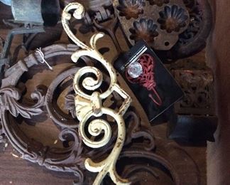 White: sold; 2 large iron brackets: $20; antique cast iron muffin pan: $15