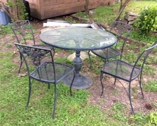 Iron table and four chairs: $200