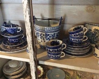 $30 all blue and white dishes in cabinet