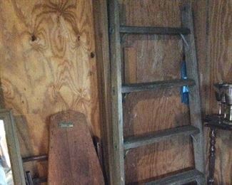 Wooden ironing board SOLD; ladder (one side) $50