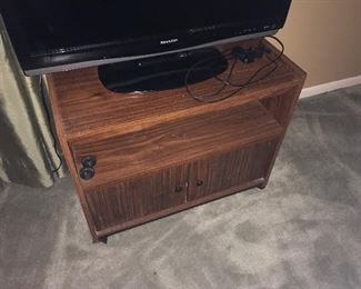 pressboard rolling tv stand. rough dimensions, in inches, 28.5w x 22.25h x 14.5d--- $45