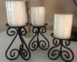 three candle holders. tallest 6.75 inches, smallest 5 inches (size doesn't include candles) $12 for the set