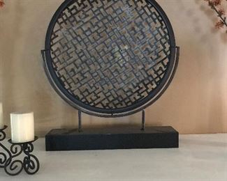 round metal art. base is 2 foot wide, piece is 30 inches tall. $25.