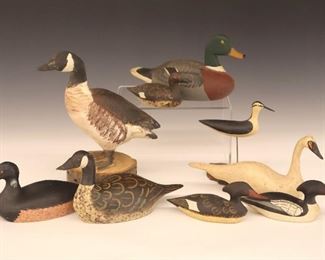 Lot 133: Nine Miniature Duck, Goose, Swan and Shorebird Decoys, by various contemporary makers. Carved wooden bodies with original paint. Slight wear overall. Up to 7" high. 