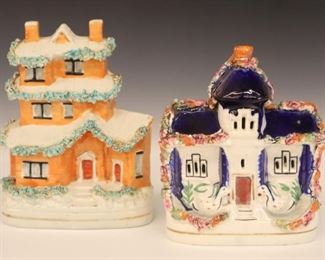 Lot 30: Two 19th century Staffordshire Cottages. Both with painted decoration with applied "moss". Wear, crazing and very minor damage, one with a hairline crack. 6 3/4" high.