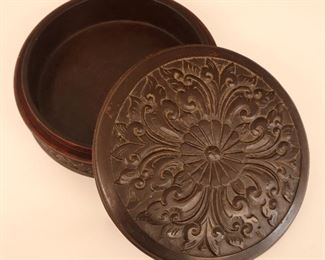 Lot 39: A 19th century Carved Hardwood Box, circular form with floral and foliate carvings. Old Finish with some wear. 9" in diameter.