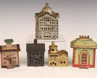 Lot 51: Five early 20th century cast iron coin banks.  All in the form of buildings, with original paint.  Some wear and minor paint loss.  Up to 4 3/4" high.