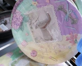 10 pkgs Amscan New baby shower motif paper plates, cups, table cloth & flatware party items  32-7" plates 16- 13" x 13" napkins, 8- 9oz cups, 1- 54" x 102" paper table cloth & 72 yellow & purple plastic forks & knives    $20 for everything