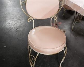Vintage bistro style mid century modern pink laminate table, leaf  & 4 chairs. 2 of the chairs have some damage to seat cushion. Table measures approx : 42" in diameter with leaf 59"  Was $695 Now $375