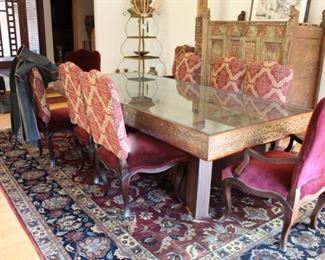 Dining room table designed using a heavily carved Balinese/Indonesian door; 4'w x 106" l x 30 ½”h; (It could be converted back to a door.) Asking $2000 (the chairs are no longer available)