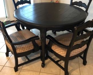 Kitchen Lot #26 Black Distressed Table w/4 chairs. (Sears need new cushions, chairs need rollers reattached.) $150.00