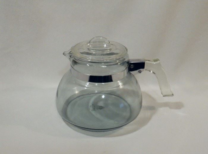 Rare, Pyrex Flameware tea kettle in super nice vintage condition.  Blue tinted glass with the green stamp (1930's) on the bottom.  No chips, cracks or rust on the metal parts.  Hold almost 3 quarts!   $40 (was $45)