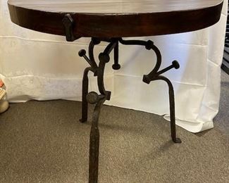 Custom Walnut plank and hand forged wrought iron table. Top is plank and 2.5" thick. Iron is 3/4-1 1/2" thick throughout. 30" round, 30" tall $800
