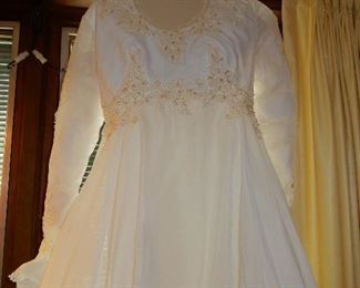 $1200   75% off is $300 for this Custom made Wedding dress approximately size 8, with 24 inch sleeves, 30 inch long train and 8 feet wide, armpit to armpit 17" or 34 circumference, Vail is 31 inches long