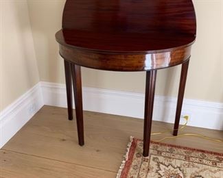 Half moon gate leg table.  Leg swings out to support the drop.  36’ round.  $200