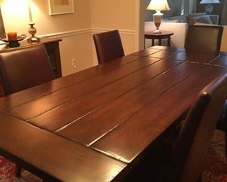 Pottery Barn solid Alder plank trestle table  Two leaves extends table to 110" x 40" (with 2  16" leaves)  Mortise and tenon joinery       $1299.00