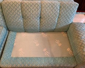 Now $385! . Amazing; 1950's curved sectional in a beautiful shade of light aqua blue with little flecks of sparkle. In very good condition! Some minor staining only on the lower back of the couch. No stains on the front of the sofa. 