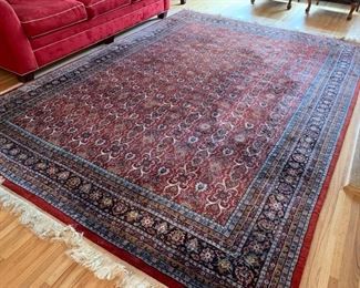 SOLD-  Large beautiful area rug. It does have one larger dark spot that appears when it was professionally cleaned, they may have concentrated too hard on that area. Please see all the photos. Price reflective of this issue. Approx 14.5lx8.25wide not including the 4" of fringe