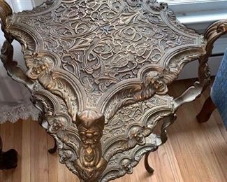 Now $50 $85 -Metal three-tiered plant stand/accent piece with figural and beautiful accents. Approximately 13.5"square on the top and 31.25" tall. Held together by screws and needs a little tightening. 