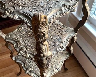 Now $50- $85 -Metal three-tiered plant stand/accent piece with figural and beautiful accents. Approximately 13.5"square on the top and 31.25" tall. Held together by screws and needs a little tightening. 