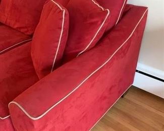 Now $185! -$250- Super comfortable microsuede vibrant red sofa with four matching throw pillows. No manufacture name. No tears in fabric, but two staining issues- one on the back left arm and the middle cushion has a stain and has been turned upside down. (see all photos)  Has light tan piping. Measures approximately 103.5" long by 42" deep and 30.5" tall in the back and 27" tall in front. The cushions measure 30" deep 26.5" wide. 