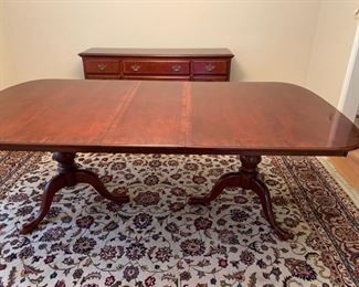 Now $150!  $195 -Very nice large dining room table and six chairs. Approximately 68" x 43" wide with the leaf adding 15" (two leaves measuring 15" each) One noticeable "ding" on the top. (ding measures approximately .75" long by .25" wide) Table is cherrywood with a veneer top and has rounded corners and an inlaid design. 