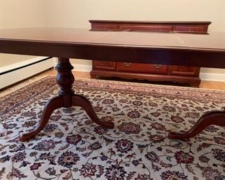Now $150!  $195 -Very nice large dining room table and six chairs. Approximately 68" x 43" wide with the leaf adding 15" (two leaves measuring 15" each) One noticeable "ding" on the top. (ding measures approximately .75" long by .25" wide) Table is cherrywood with a veneer top and has rounded corners and an inlaid design. 