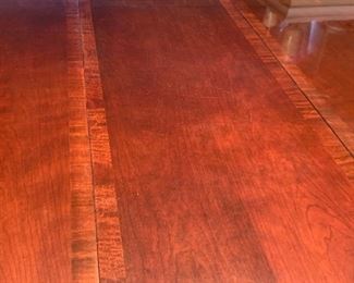 Now $150!  $195 -Very nice large dining room table and six chairs. Approximately 68" x 43" wide with the leaf adding 15" (two leaves measuring 15" each) One noticeable "ding" on the top. (ding measures approximately .75" long by .25" wide) Table is cherrywood with a veneer top and has rounded corners and an inlaid design. 
