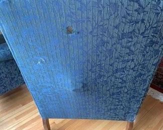 Now $25!  $45-Pair of upholstered high-back chairs in two tones of blue with a leaf pattern design and claw feet. One of the chairs is in poor condition and one is in very good condition. (poor condition chair has a stain on the seat and broken springs in the back) Price is basically, buy one and get the one that needs repair. Chairs each measure 34" arm to arm, seats measure 27"w x 19.5" and the back is 29" tall.