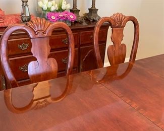 Now $150!  $195 -Very nice large dining room table and six chairs. Approximately 68" x 43" wide with the leaf adding 15" (two leaves measuring 15" each) One noticeable "ding" on the top. (ding measures approximately .75" long by .25" wide) Table is cherrywood with a veneer top and has rounded corners and an inlaid design. 