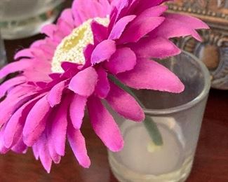 $10- Lot of home decor items; two hurricane holders about 12" tall, 2 faux Lilly's in vases and 6 mini vases with purple daisies. 